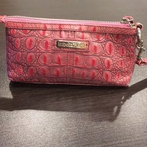 Pink magenta embossed leather wristlet